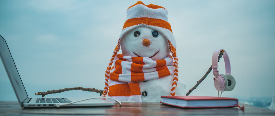 Snowman with laptop and headphones